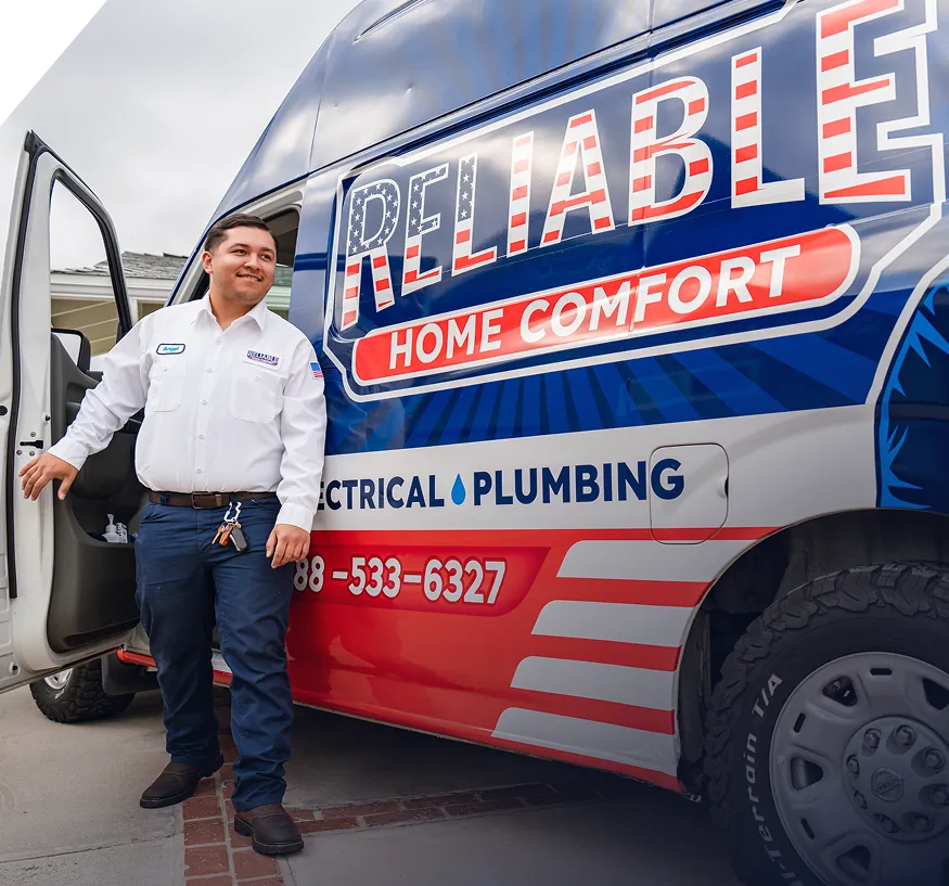 Reliable Home Comfort technician stepping out of a branded service van in Norwalk, CA, providing HVAC, electrical, and plumbing services.