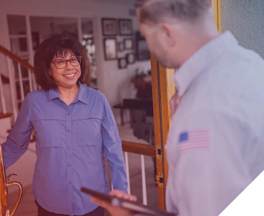 Reliable Home Comfort technician greeting a homeowner during a service visit in Norwalk, CA.