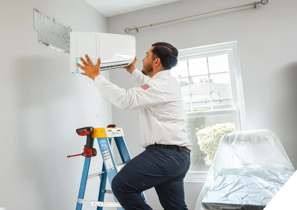 Reliable Home Comfort HVAC installer mounting ductless mini-split system indoors – energy-efficient air conditioning in Los Angeles