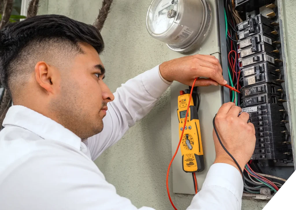 Reliable Home Comfort electrician testing circuit breakers – electrical panel inspection and diagnostics in Los Angeles.