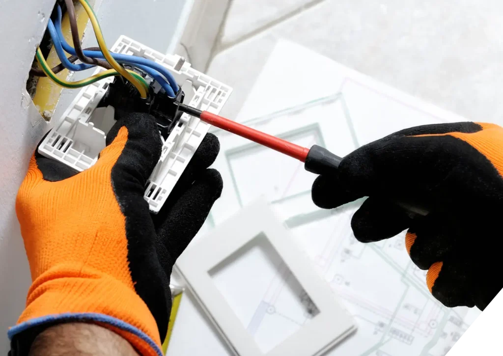 Close-up of electrical technician wiring wall switch – professional residential Electrical Repairs & Troubleshooting in Los Angeles.