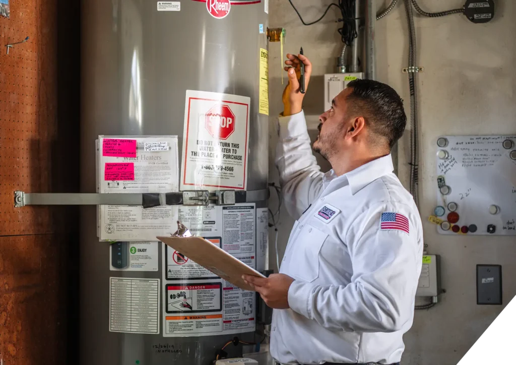 Reliable Home Comfort plumbing technician performing water heater inspection – trusted water heater installation in Los Angeles homes.